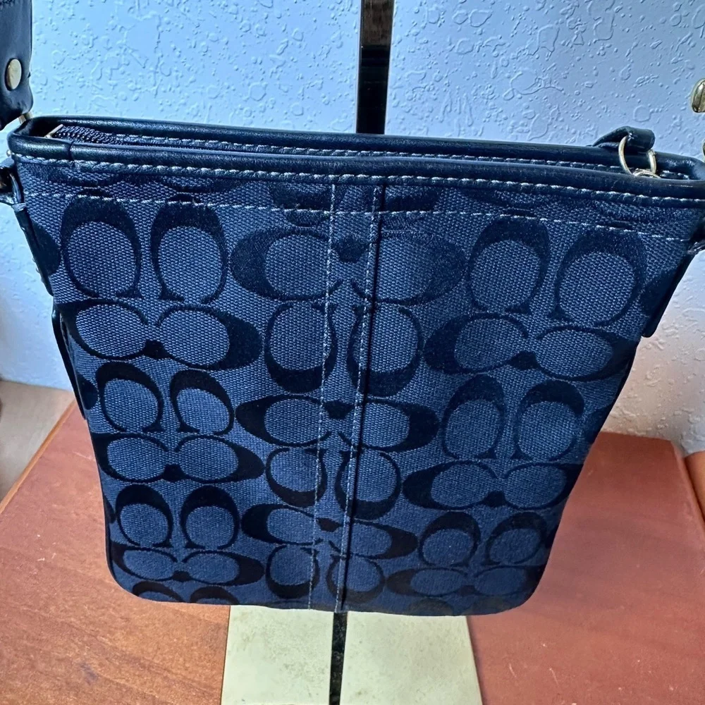 Coach Black Signature Crossbody Bag with brass hardware